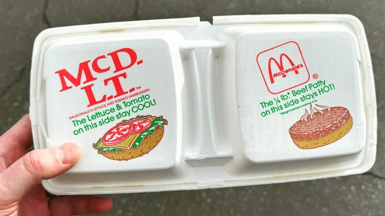 Hand holding packaging of McDonald's McDLT