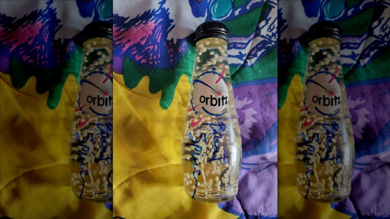 Signed Orbitz drink bottle on blanket