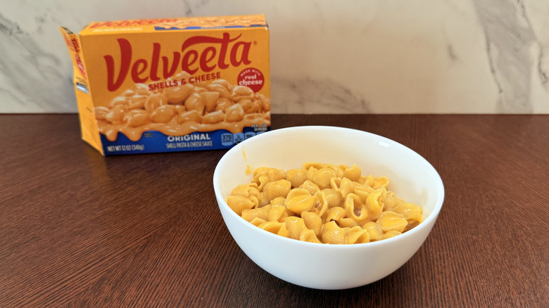 Box of Velveeta and a bowl of shells and cheese