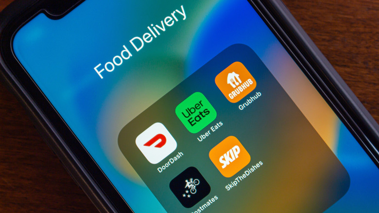 A smartphone screen showing various food delivery apps