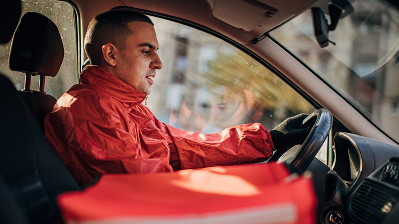 Food delivery driver driving car