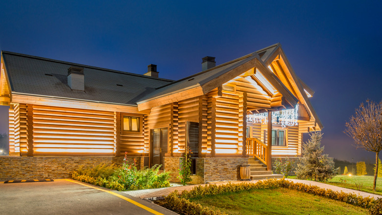 A well lit house during evening hours