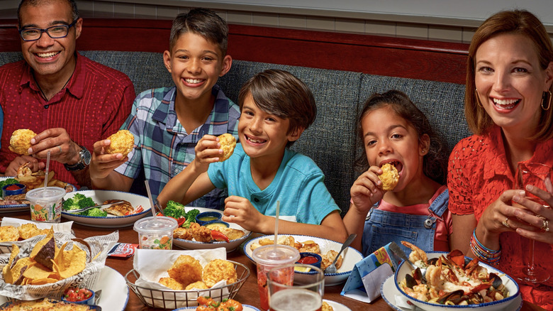 Adults and children eating at Red Lobster