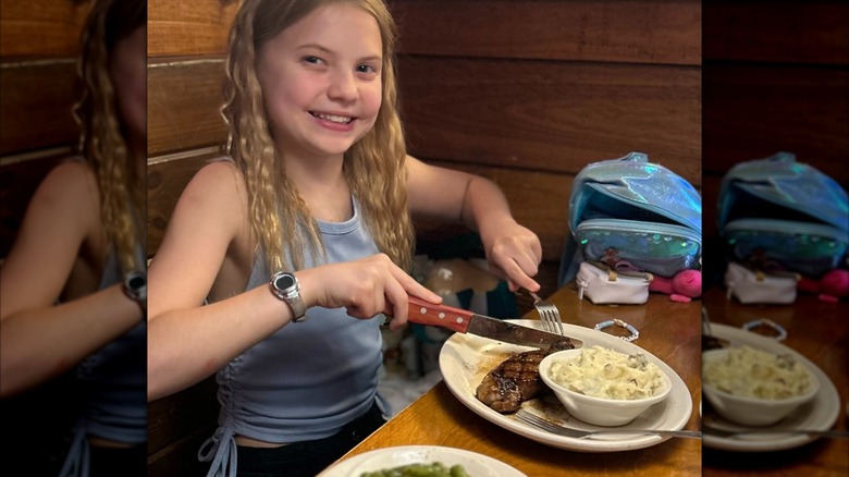 Girl eating at Texas Roadhouse