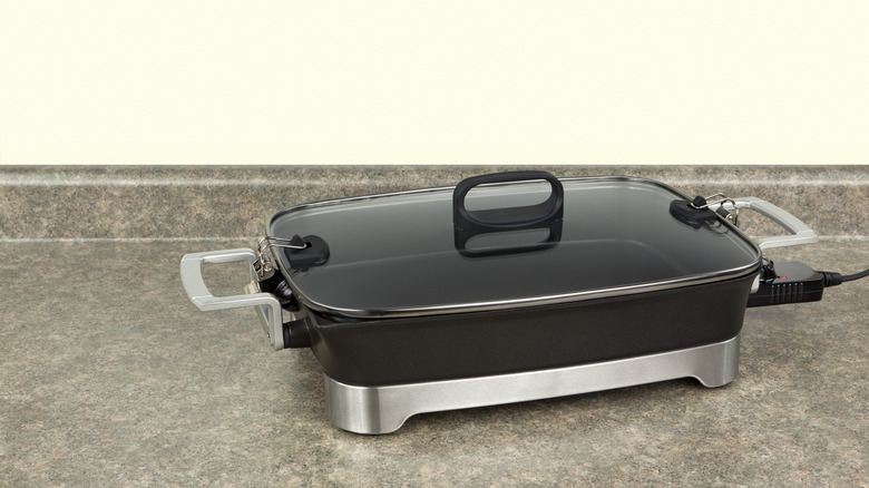 An electric skillet on a countertop