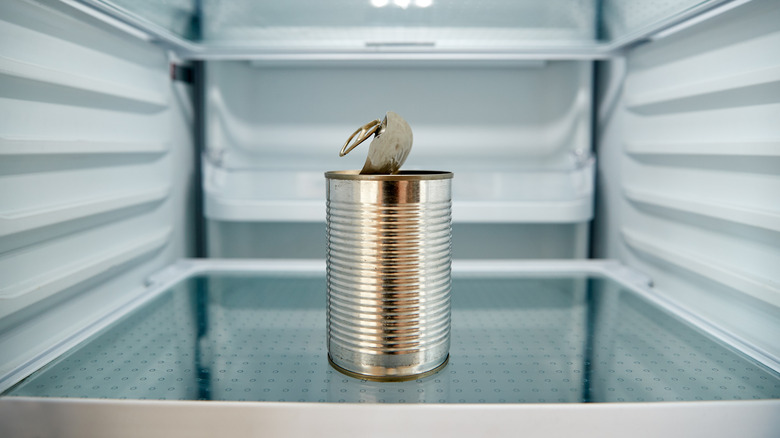 Open can of food in fridge