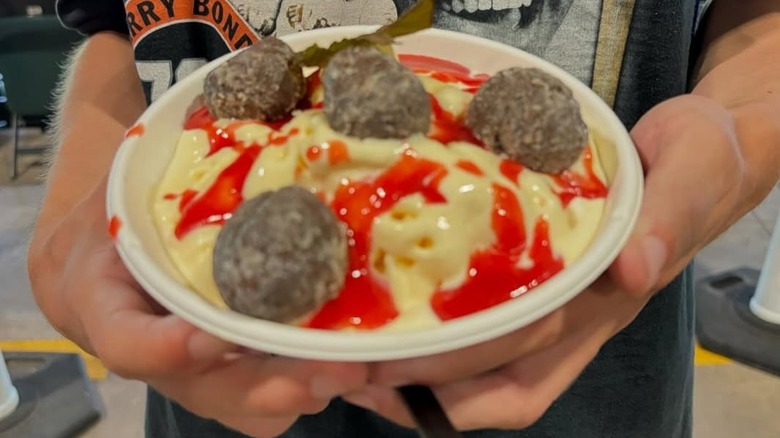 hands holding bowl of POlar Pasta