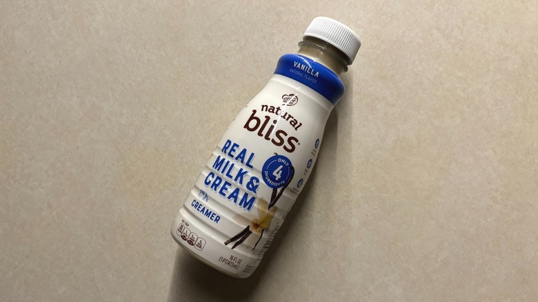 Natural Bliss Vanilla Liquid Dairy Coffee Creamer bottle on counter