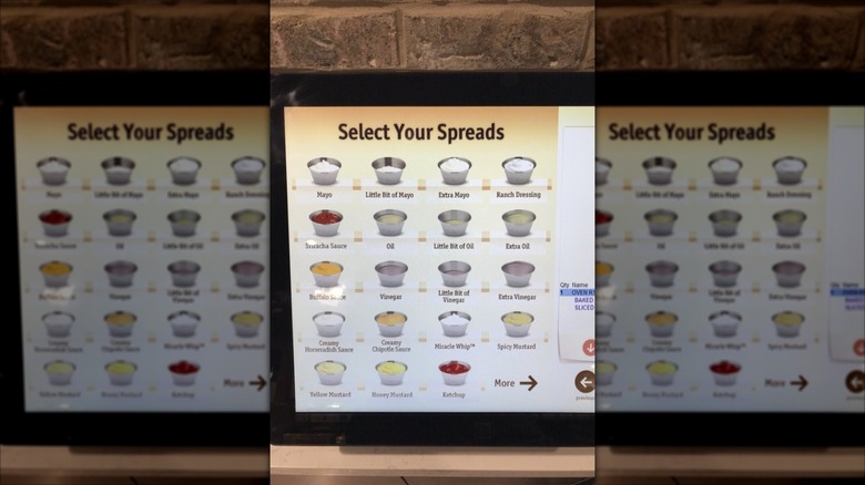 Touchscreen menu at a Wawa convenience store showing sauce options for hoagie sandwich, like mayo, oil, and ketchup