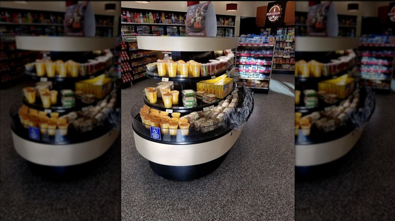 Grab and Go stand at a Wawa convenience store with fruit, wrap, and sandwich options