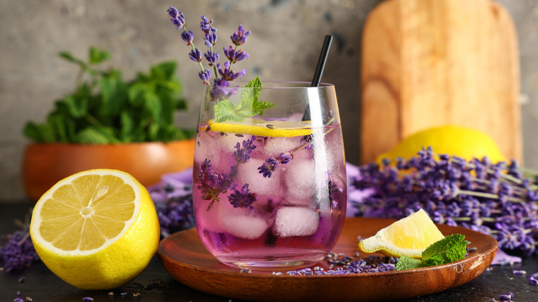 A glass of lemonade with fresh lavender