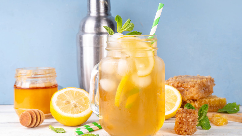A glass of lemonade with honey