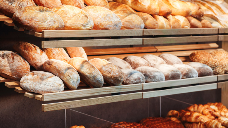 Shelves filled with loaves of freshly baked bread