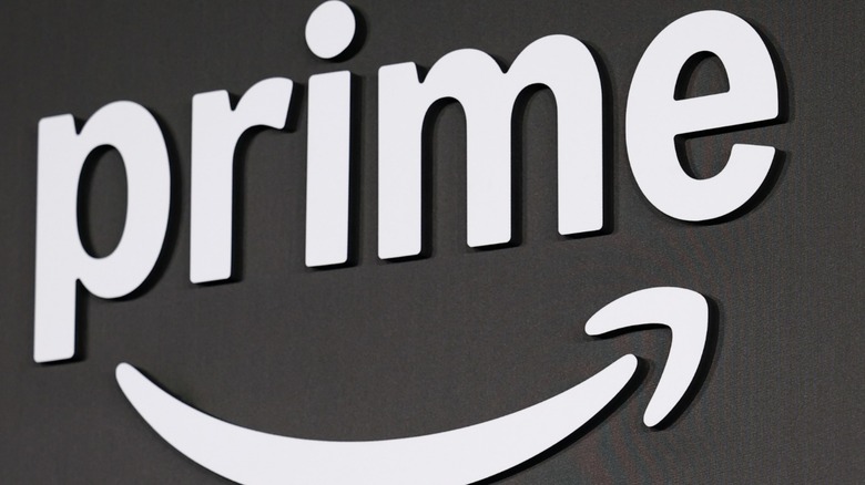 White Amazon Prime logo on dark background.