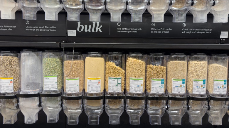 Plastic canisters full of spices in the Whole Foods bulk section
