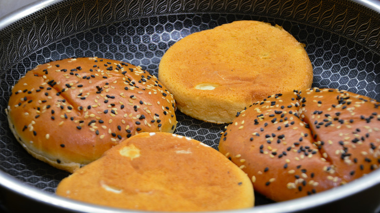 Buns toasting in a skillet