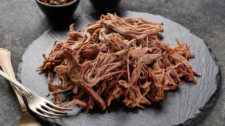 Shredded beef with two forks