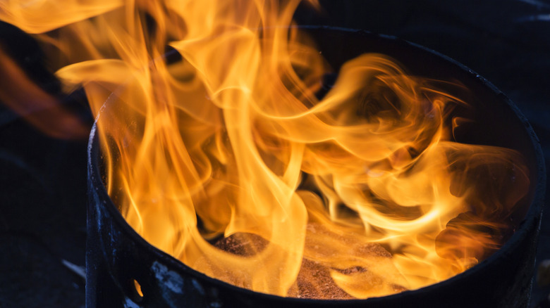 Close-up of a frying pan with high flames