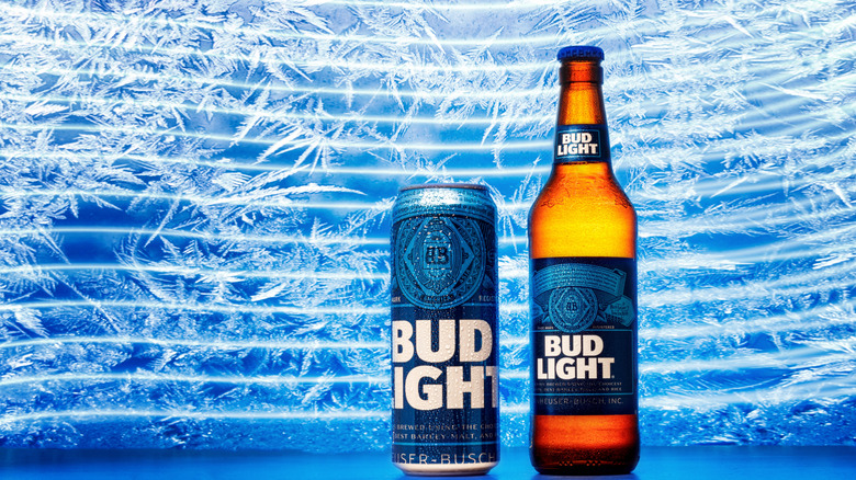 A can and bottle of Bud Light against a blue icy background
