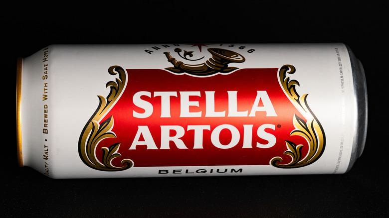 A can of Stella Artois on a black background