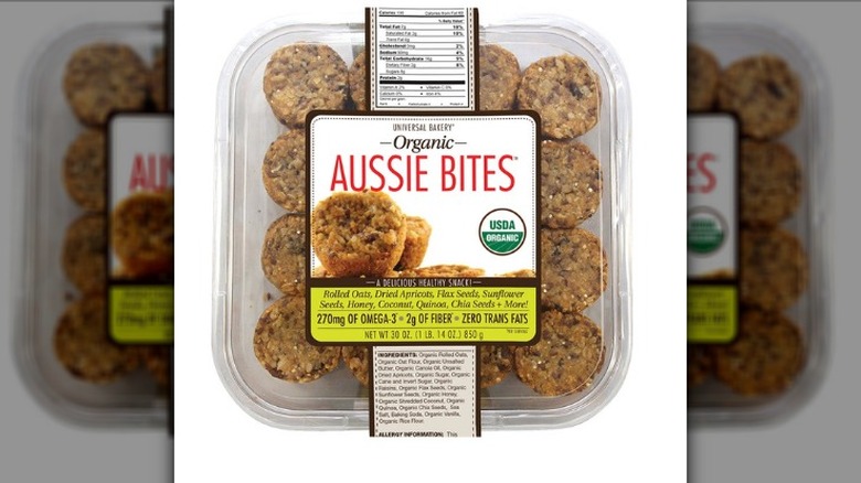 A clear plastic package of Universal Bakery Organic Aussie Bites on a white background.