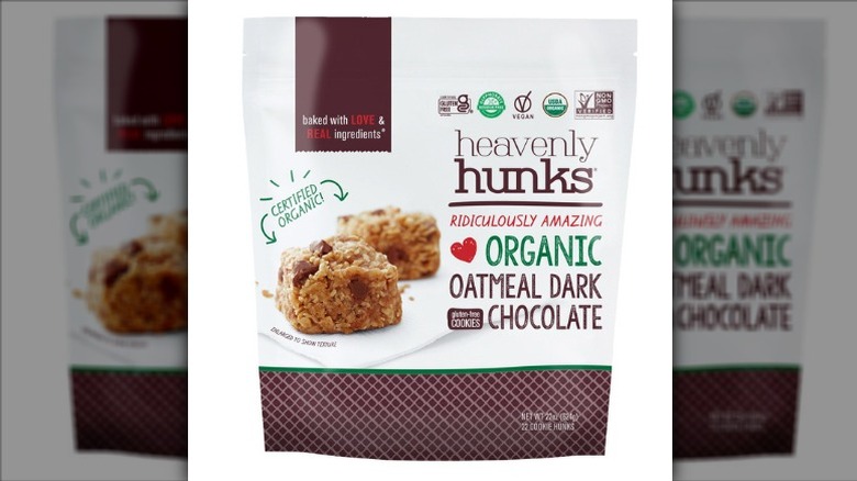 A bag of Heavenly Hunks Organic Oatmeal Dark Chocolate Cookies on a white background.