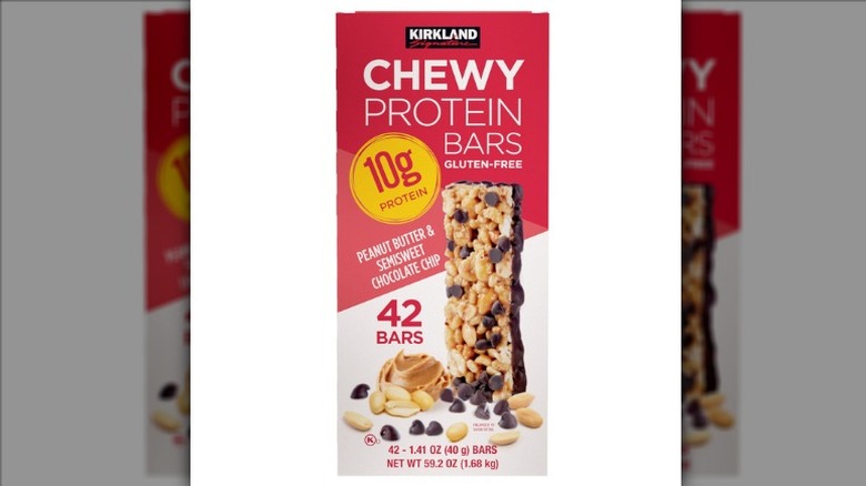 A package of Kirkland Signature Peanut Butter and Semisweet Chocolate Chip Chewy Protein Bars on a white background.