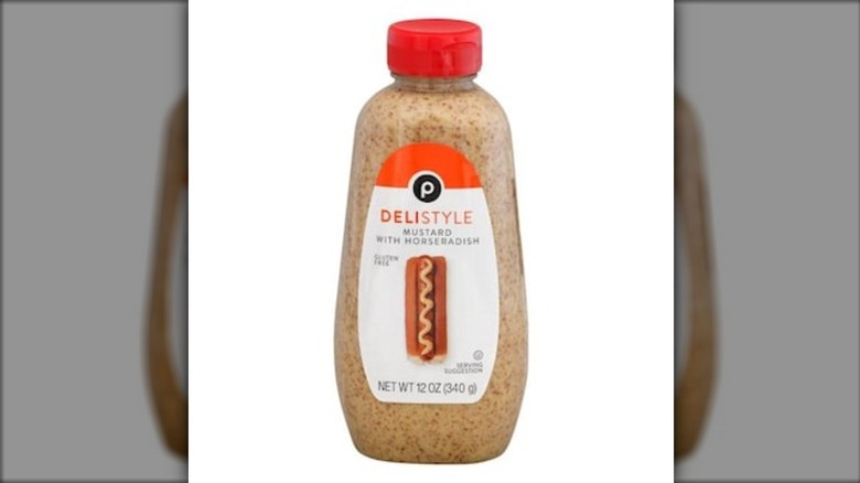 A squeeze bottle of Publix deli-style mustard with horseradish on a white background.