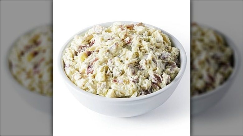 Publix deli red potato salad in a white bowl on a white background.