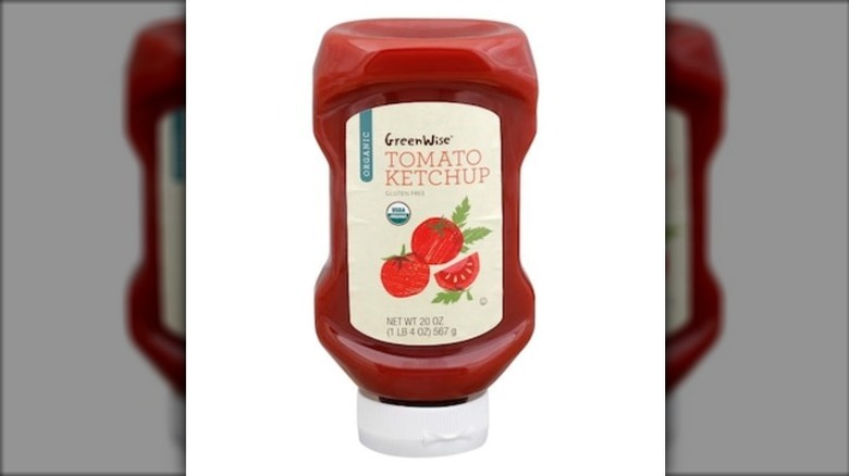 A squeeze bottle of Greenwise organic tomato ketchup on a white background.