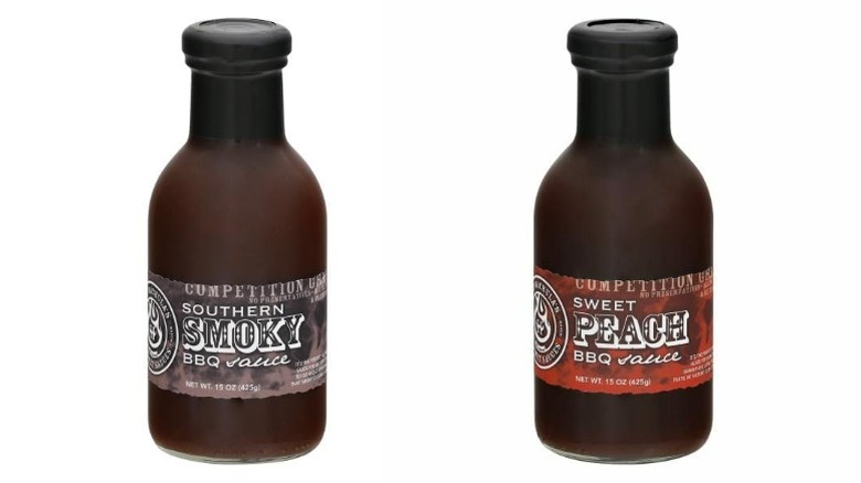 Bottles of Hot Wachula's Southern Smoky and Sweet Peach barbecue sauce on a white background.