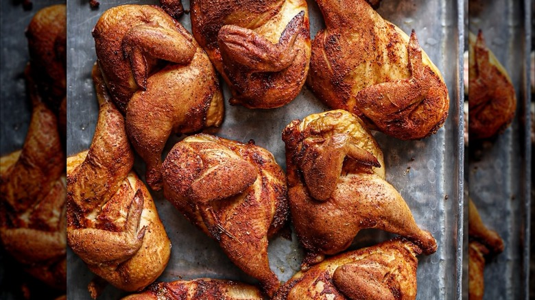 Tray of smoked and seasoned chicken halves at Southern Soul Barbeque