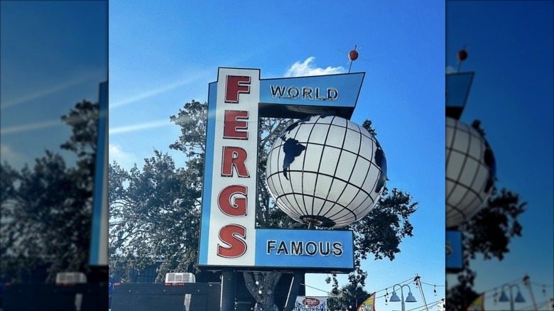 A vintage-looking outdoor sign for Ferg's in red, white, and blue