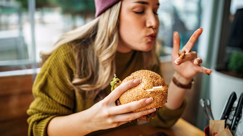 woman eating a burger