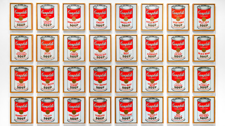 Rows of Andy Warhol Campbell's iconic soup can paintings