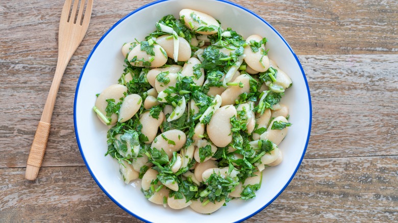 Lima beans in salad with fork