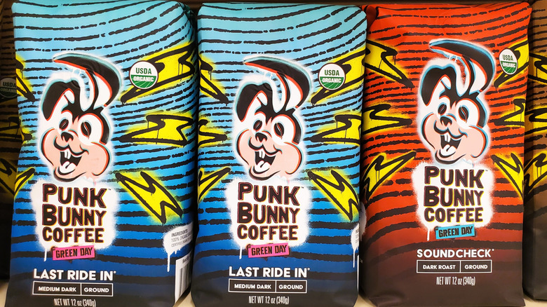 Three colorful bags of coffee featuring a cartoon bunny and lightning bolts