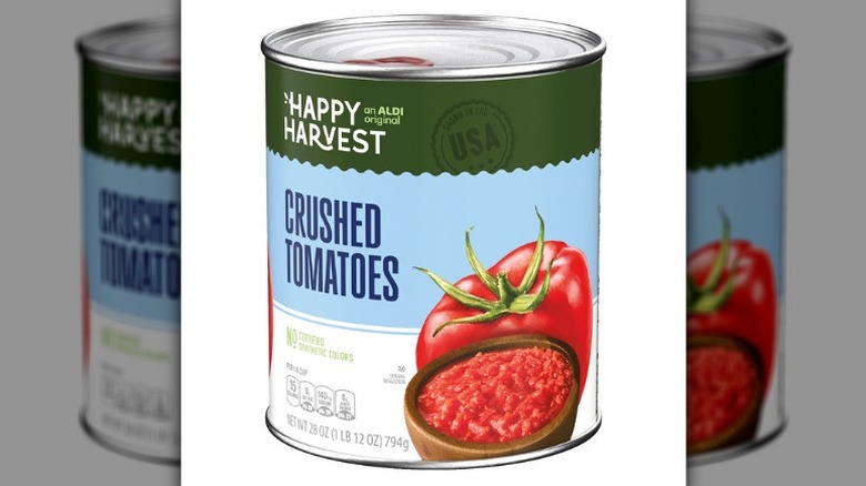 A can of Happy Harvest Crushed Tomatoes from Aldi on a white background
