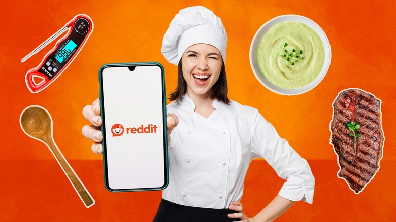 smiling female chef holding phone surrounded by food and kitchen gadgets