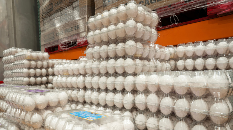 Towers of clear plastic cartons of eggs stacked up at Costco