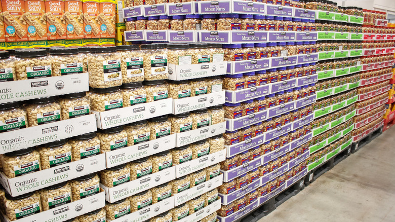 Costco nut aisle with big tubs of cashews and mixed nuts