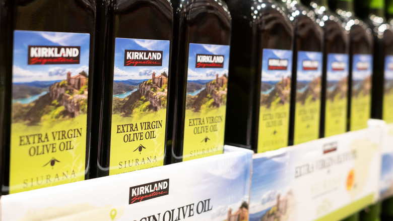 Row of bottles of Kirkland extra virgin olive oil