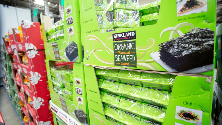 Bright green boxes with Kirkland Signature roasted seaweed on display at Costco