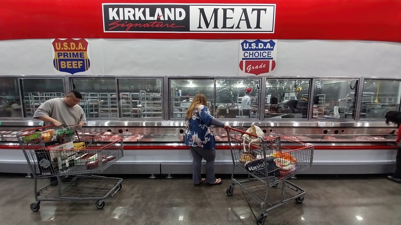 Customers shopping in the meat section at Costco