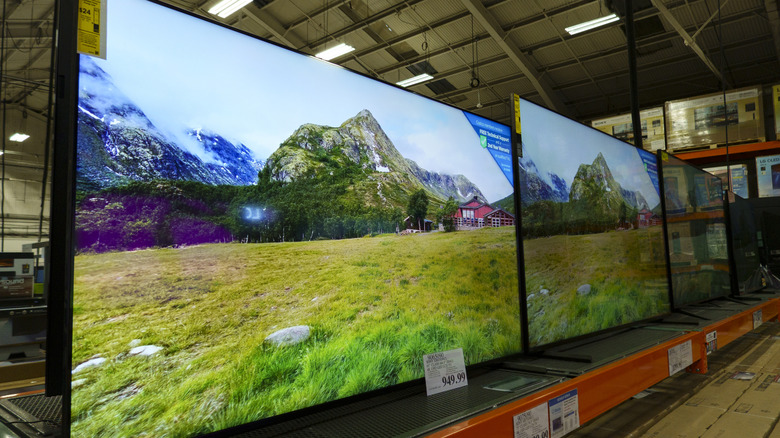 Large screen television sets in a Costco warehouse