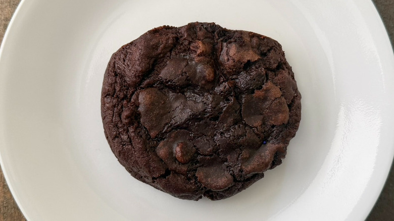 A Brownie Batter Cookie from Crumbl on a white plate