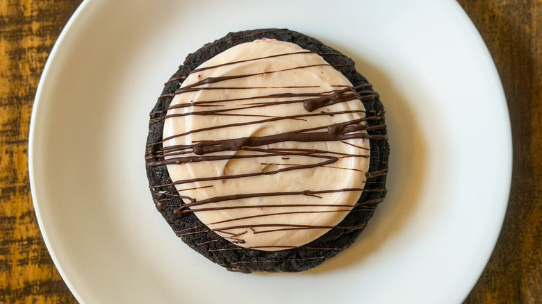 A Crumbl Chocolate Covered Strawberry Cookie on a white plate