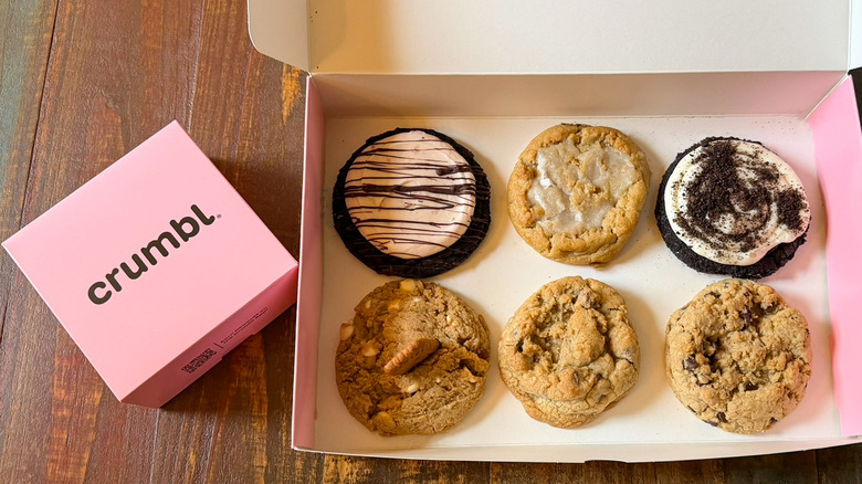An open box of Crumbl cookies, ready to taste and review