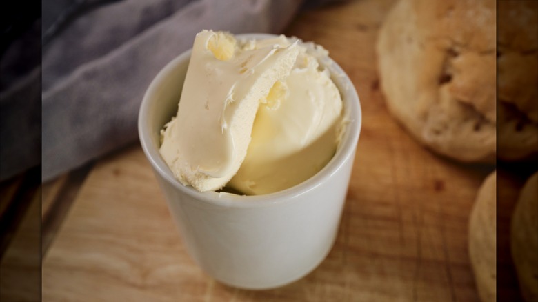 Close up of a small cup filled with Clotted Cream.
