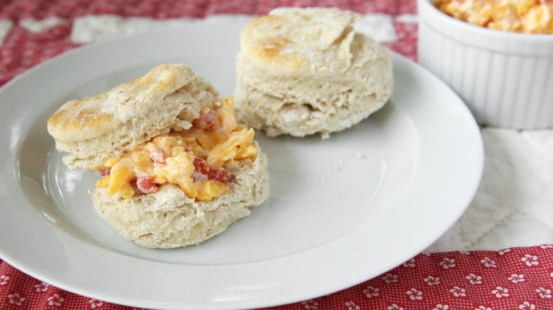 Fresh biscuits and Southern-style pimento cheese on white plate